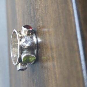 Elegant Silver Ring with Red, Green, and Clear Stones